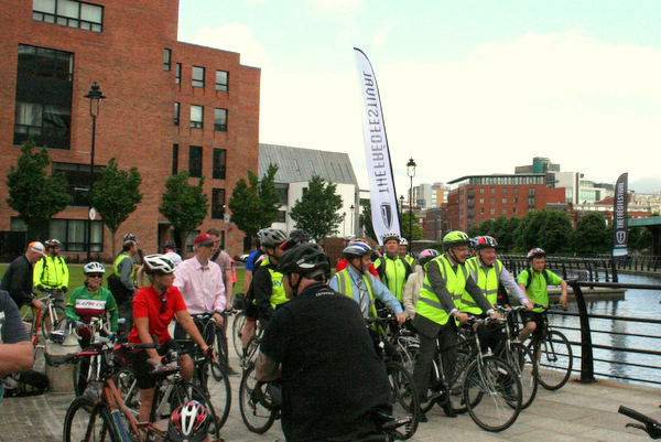 Minister Danny Kennedy arrives with his bicycle outrides