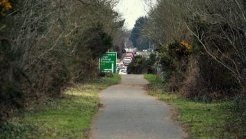 Former railway alignment around Comber visible, first as greenway then as road ©nigreenways Former railway alignment around Cmber visible, first as greenway then as road