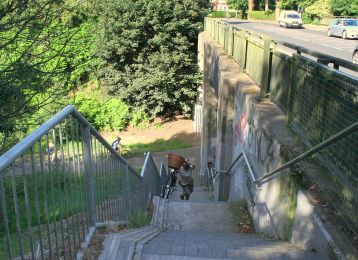 Climbing the North Road steps using the bicycle gutter ©nigreenways Climbing the North Road steps using the bicycle gutter